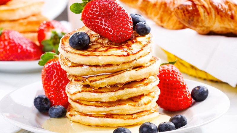 American pancakes, fruit, strawberry, blueberry, honey (horizontal)