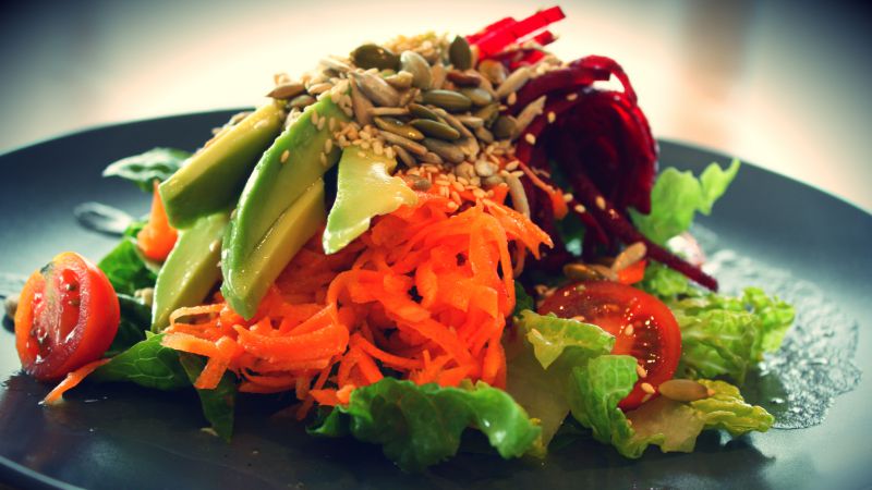 Salad, Lettuce, tomato, avocado, sesame seeds, carrots, sunflower seeds (horizontal)