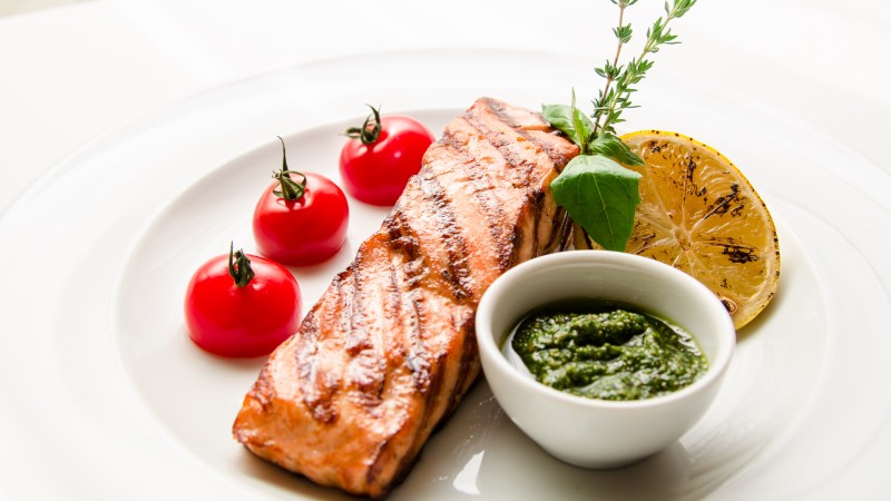 steak, salmon, fish, cherry tomatoes, sauce, tarragon, thyme, lemon (horizontal)