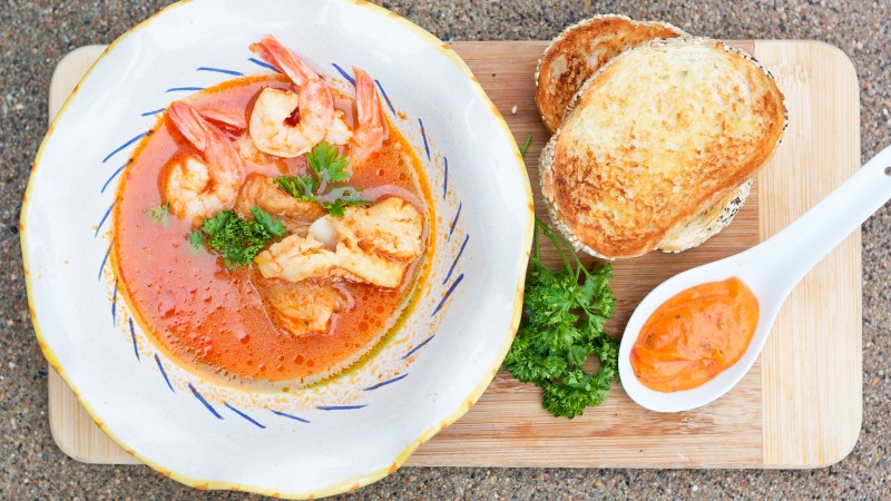 seafood soup, shrimp, tomato sauce, greens, croutons (horizontal)