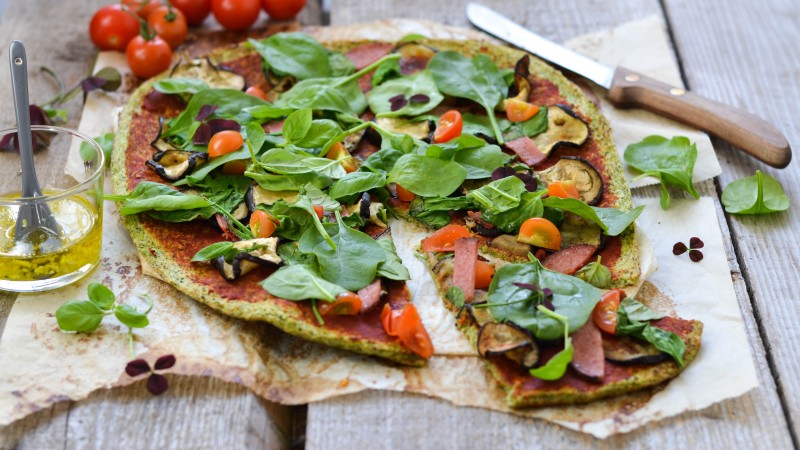 pizza, broccoli, parsley, basil, saffron, tomatoes, sausage, zucchini (horizontal)