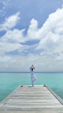 Yoga, beach, sea, blue, sky (vertical)