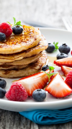 Pancakes, raspberry, fruit, strawberry, blueberry, honey (vertical)