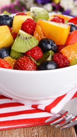 salad, fruits, raspberries, strawberries, blueberries, grapes, kiwi, mango, orange (vertical)