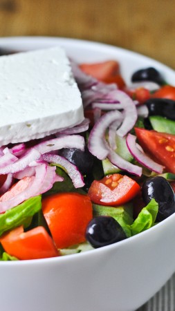 Greek, cooking, recipe, lettuce, tomatoes, cucumbers, olives, feta, onion (vertical)